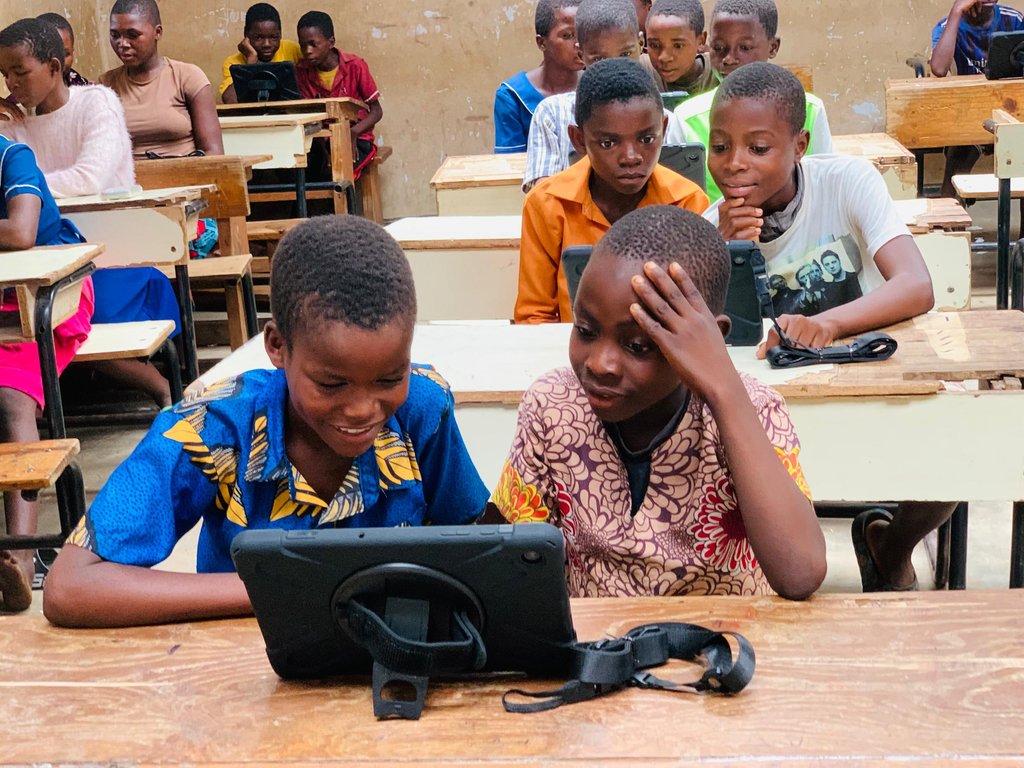 Students using Abundelo tablets in a classroom